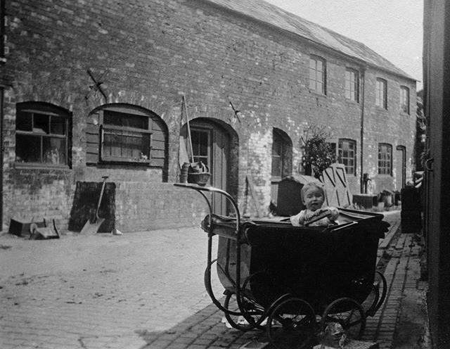 Ashley House Yard, Donald Welford in pram