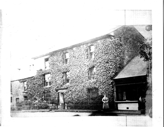 Holcombe covered in Ivy. Was it a school then?