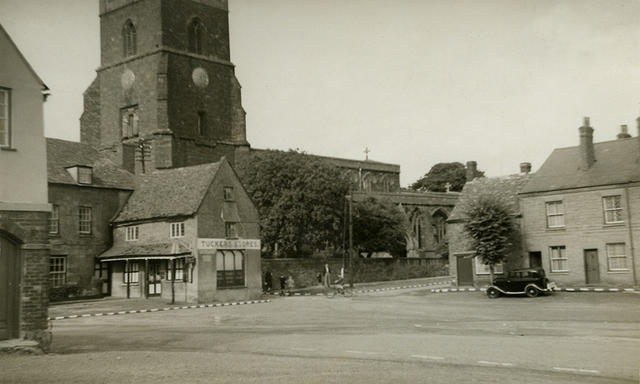 The Market Place. Note the white paint on the car wings and the kerb stones