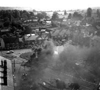 Spectators on the south side of the Market Place following the action, 10952_03