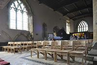 New chairs replacing the old, darker pews