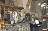 Land girls with Elsa Williams at the piano