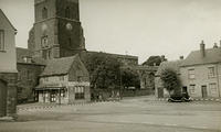 The Market Place. Note the white paint on the car wings and the kerb stones