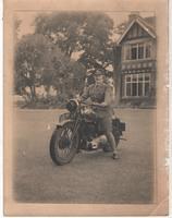 astride her beloved motor bike