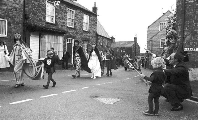 Visitors from the Castle entering the Market Place