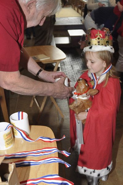 The winner receiving her prize from Jim Flux