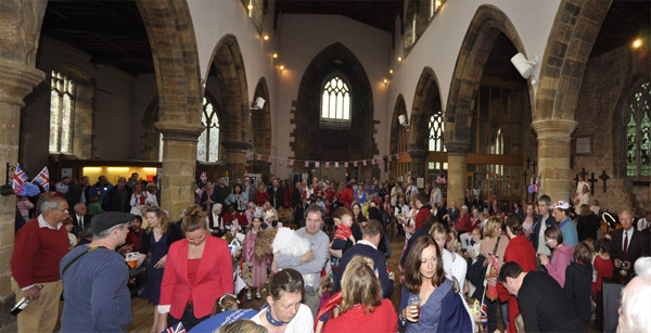 Villagers filling the church into the evening