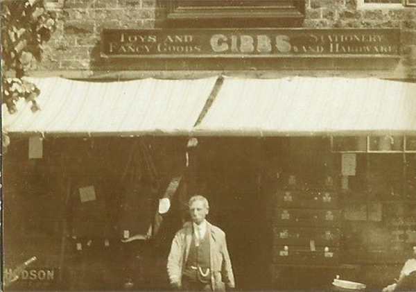 Joshua Gibbs in front of his shop, c.1900