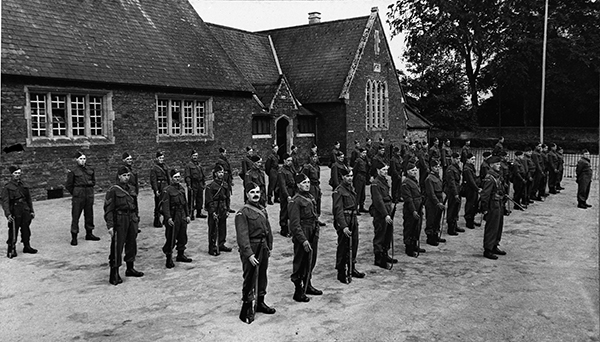 Home Guard lined up outside the primary school, 10,512