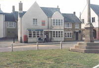 The newly constructed house and War Memorial in the 'Market Place'