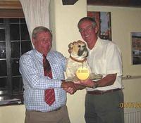 Nigel Oddy presents the trophy to Dorchester team Captain Richard Moore