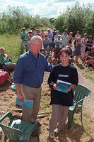 John Craven presenting the Treasure Hunt prize to Freddie Meagher