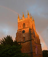 Rainbow over church tower