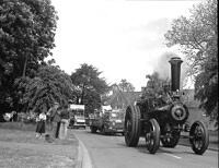 The traction engine leads the parade of floats
