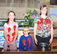 Trophy winners in the Children's sections: Becky Skinner (r), Polly Banks (l) and Jay Cox (c)
